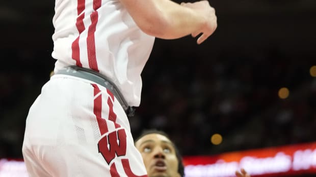 Mar 2, 2023; Madison, Wisconsin, USA; Wisconsin Badgers guard Max Klesmit (11) shoots the ball during the second half against the Purdue Boilermakers at the Kohl Center. Mandatory Credit: Kayla Wolf-USA TODAY Sports